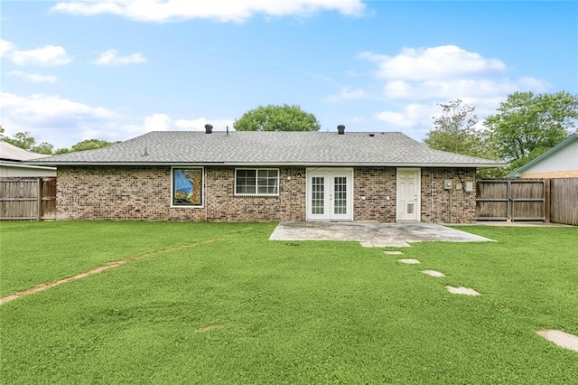 8752 Leisure Dr, Denham Springs, LA 70726 - back of property featuring a patio, a fenced backyard, a lawn, and french doors