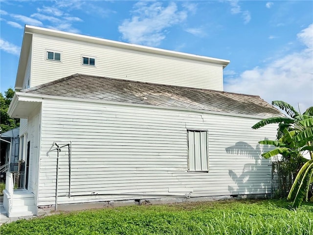 view of home's exterior featuring a shingled roof