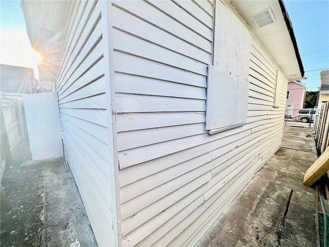 view of side of property featuring fence