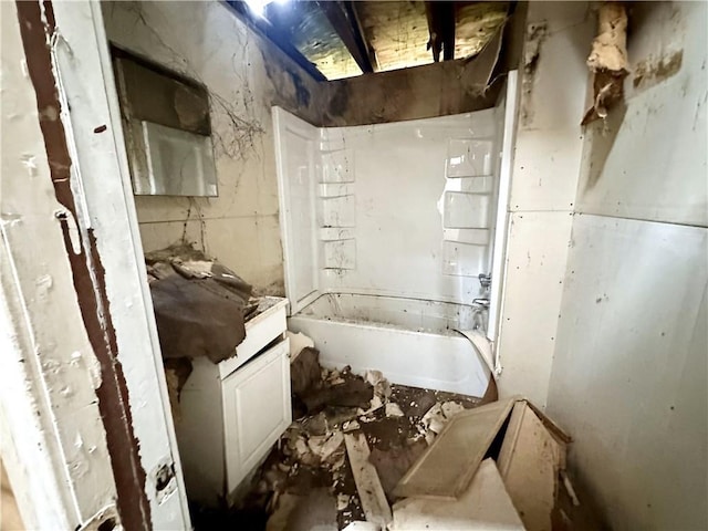 bathroom with walk in shower, a tub to relax in, and vanity