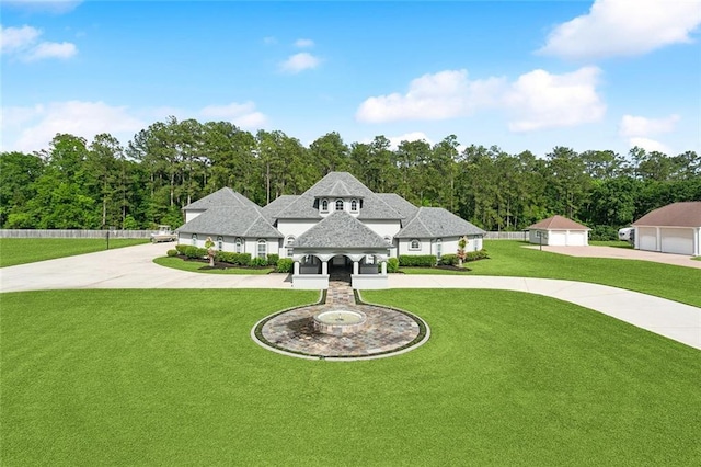 30222 N Dixie Ranch Rd, Lacombe, LA 70445 - french provincial home featuring curved driveway, a shingled roof, and a detached garage