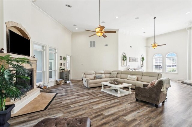 30222 N Dixie Ranch Rd, Lacombe, LA 70445 - living room featuring a ceiling fan, crown molding, a high ceiling, wood finished floors, and recessed lighting