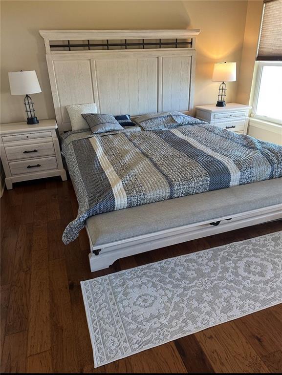 bedroom featuring dark wood-style floors