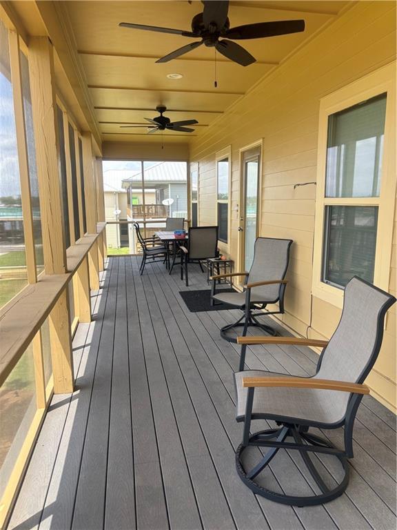wooden terrace with ceiling fan