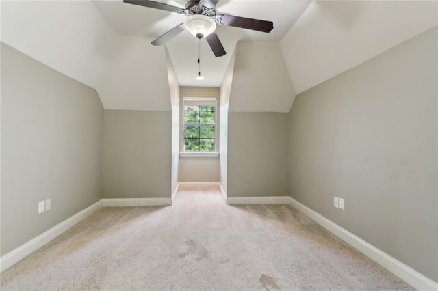 bonus room with baseboards, a ceiling fan, carpet, and lofted ceiling