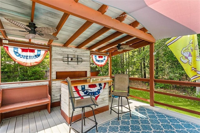 sunroom / solarium featuring ceiling fan