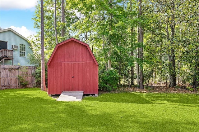 view of shed featuring fence