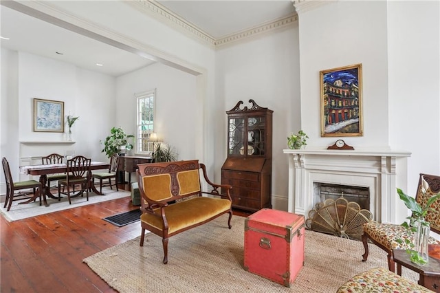 sitting room featuring wood-type flooring and a fireplace