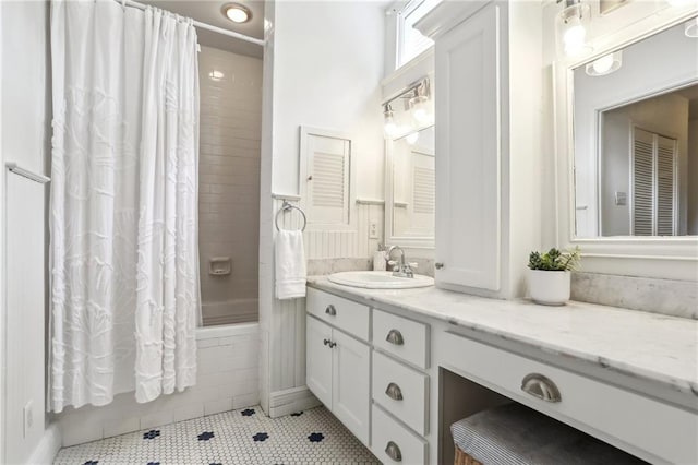 full bathroom featuring vanity, shower / tub combo with curtain, and tile patterned floors