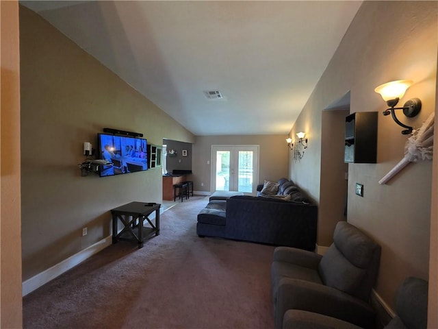 carpeted living area featuring visible vents, baseboards, and vaulted ceiling