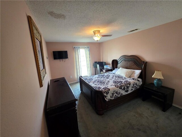 bedroom with ceiling fan, a textured ceiling, visible vents, baseboards, and carpet flooring