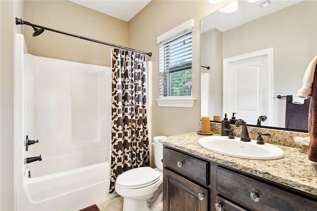 bathroom featuring vanity, visible vents, toilet, and shower / bath combination with curtain