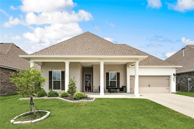 view of front of house with driveway, roof with shingles, a front yard, a garage, and stucco siding