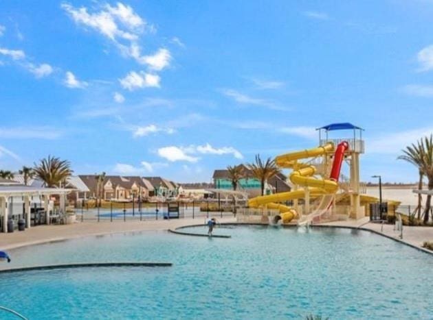 community pool with a water slide