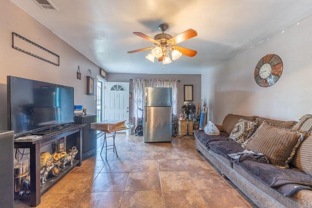 living area with visible vents and a ceiling fan