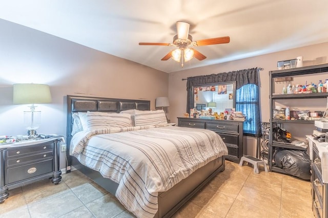 bedroom featuring light tile patterned flooring and a ceiling fan