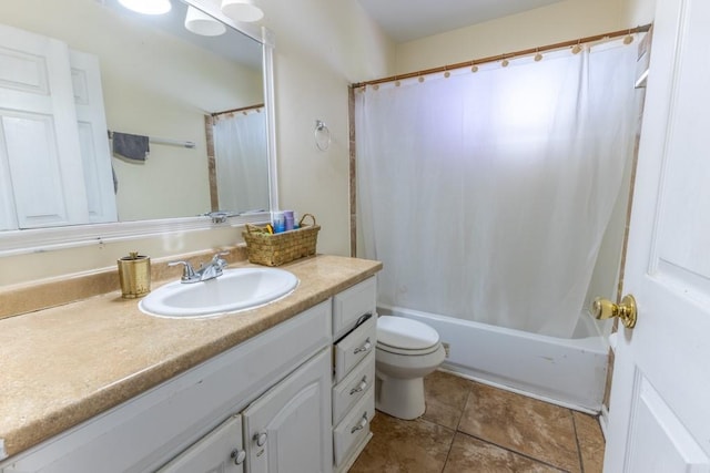bathroom with vanity, tile patterned flooring, shower / bath combo with shower curtain, and toilet