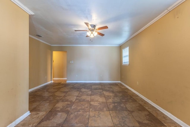spare room featuring baseboards, ornamental molding, ceiling fan, and visible vents
