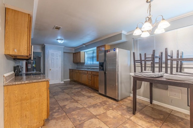 kitchen with visible vents, ornamental molding, a notable chandelier, and stainless steel fridge with ice dispenser