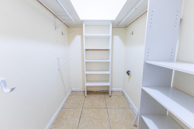 walk in closet featuring light tile patterned floors