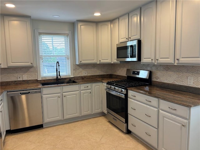 101 W William David Pkwy Unit D, Metairie, LA 70005 - kitchen featuring recessed lighting, a sink, decorative backsplash, and appliances with stainless steel finishes