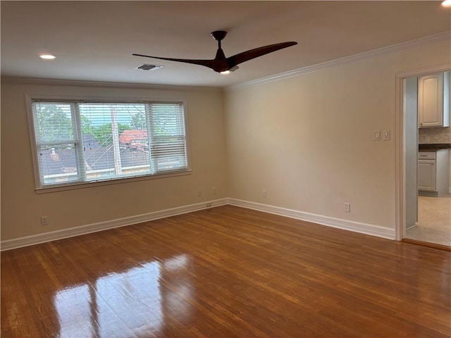 101 W William David Pkwy Unit D, Metairie, LA 70005 - empty room featuring visible vents, ornamental molding, a ceiling fan, and hardwood / wood-style flooring