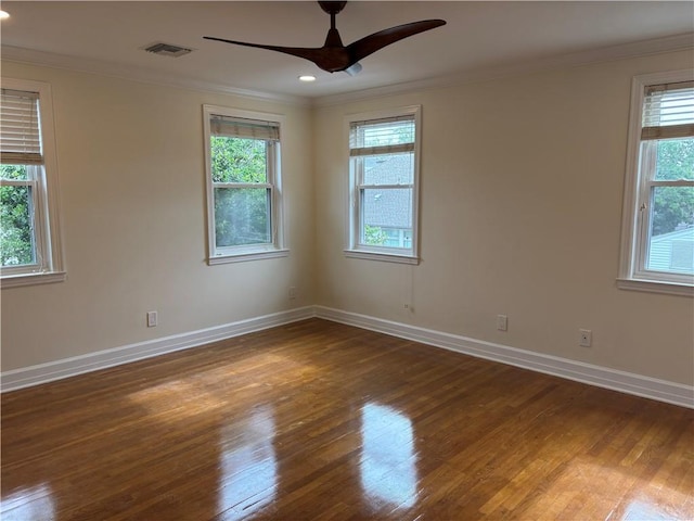 101 W William David Pkwy Unit D, Metairie, LA 70005 - empty room featuring crown molding, baseboards, visible vents, and wood finished floors