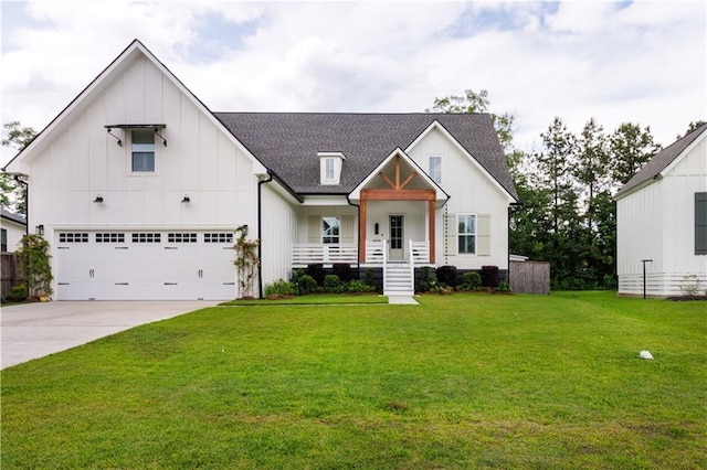 modern inspired farmhouse featuring board and batten siding, driveway, a front lawn, an attached garage, and a shingled roof