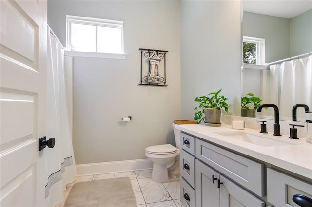 bathroom featuring vanity, marble finish floor, toilet, baseboards, and a shower with curtain