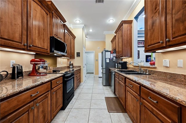 216 Old Mill Loop, Pearl River, LA 70452 - kitchen with appliances with stainless steel finishes, crown molding, dark stone counters, light tile patterned floors, and recessed lighting