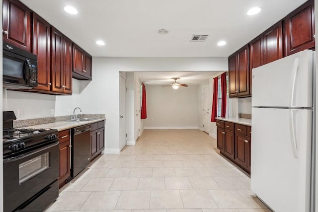 kitchen with recessed lighting, visible vents, a sink, and black appliances