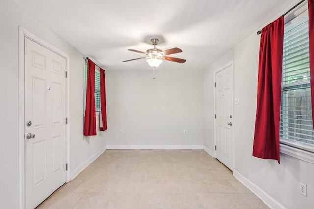 entrance foyer featuring baseboards and a ceiling fan