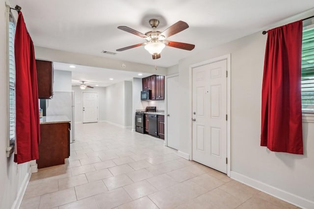 interior space with ceiling fan, recessed lighting, baseboards, light tile patterned floors, and visible vents