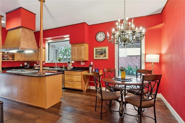 2100 Jefferson Ave, New Orleans, LA 70115 - kitchen with dark countertops, dark wood-type flooring, and custom exhaust hood