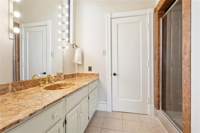 2100 Jefferson Ave, New Orleans, LA 70115 - bathroom with tile patterned floors, vanity, and a shower stall