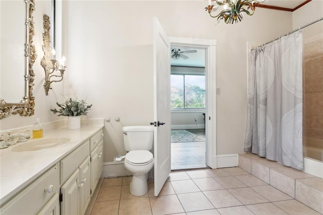 2100 Jefferson Ave, New Orleans, LA 70115 - full bathroom with vanity, toilet, tile patterned flooring, and baseboards