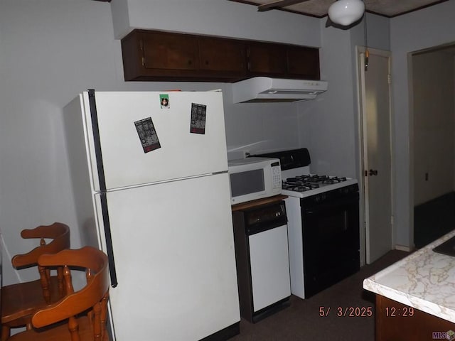 kitchen with white appliances, extractor fan, light countertops, and dark brown cabinets