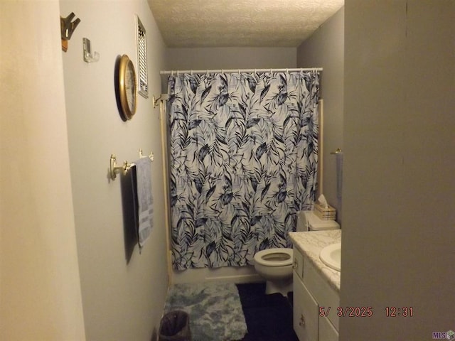 bathroom with toilet, a shower with shower curtain, a textured ceiling, and vanity