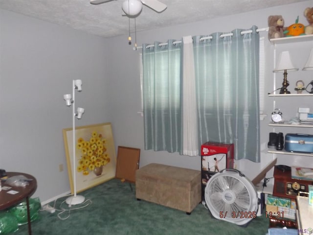 bedroom featuring carpet floors, a textured ceiling, and ceiling fan