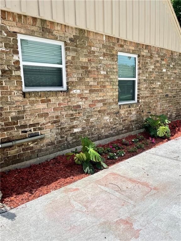 2644 Ramsey Dr, New Orleans, LA 70131 - view of property exterior featuring brick siding and board and batten siding