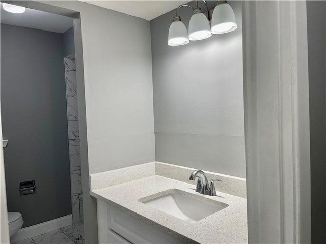 2644 Ramsey Dr, New Orleans, LA 70131 - bathroom featuring vanity, marble finish floor, and toilet
