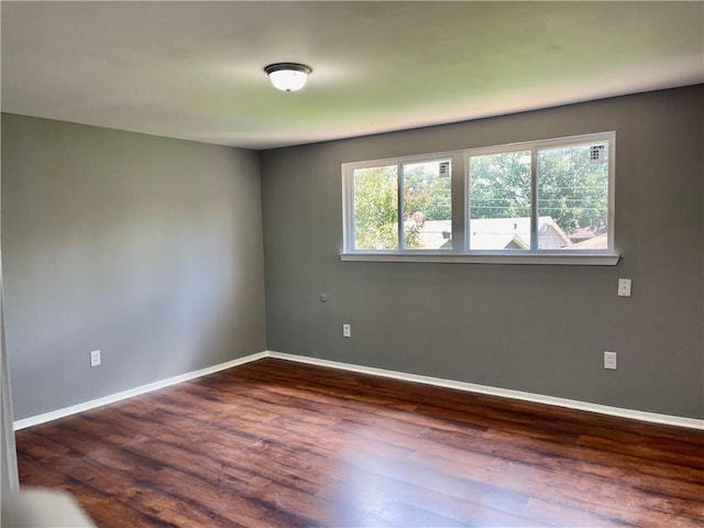 2644 Ramsey Dr, New Orleans, LA 70131 - unfurnished room with a healthy amount of sunlight, baseboards, and dark wood-style floors
