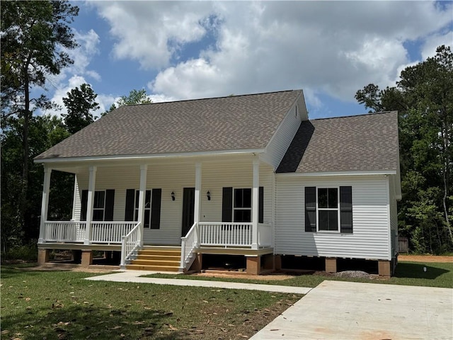 view of front of house with a porch, a shingled roof, and a front lawn