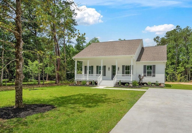71131 Sanders St, Abita Springs, LA 70420 - view of front of house featuring covered porch, a front yard, and a shingled roof