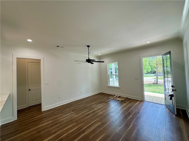 interior space featuring dark wood-style flooring, ceiling fan, recessed lighting, baseboards, and ornamental molding