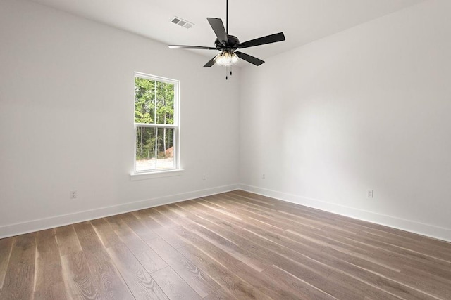 71131 Sanders St, Abita Springs, LA 70420 - unfurnished room with baseboards, wood finished floors, and a ceiling fan