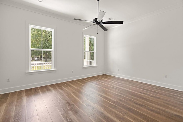 71131 Sanders St, Abita Springs, LA 70420 - empty room with baseboards, dark wood-type flooring, a ceiling fan, and ornamental molding