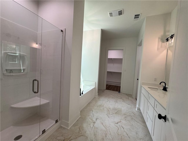 bathroom featuring visible vents, a shower stall, and marble finish floor