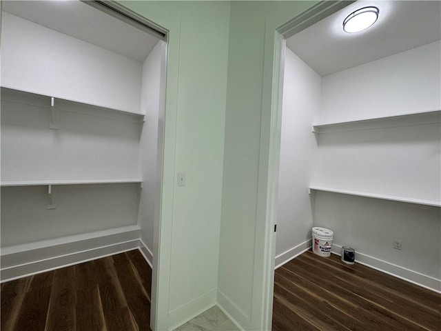 washroom featuring baseboards and wood finished floors