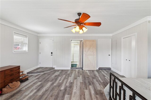 7020 Wilty St, Metairie, LA 70003 - foyer featuring crown molding, wood finished floors, and a ceiling fan